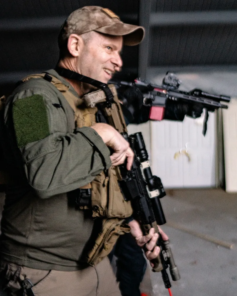 Patrick Kapenga in tactical gear holding a rifle during a SWAT training session