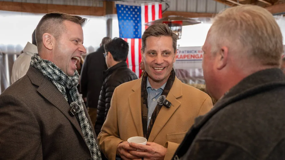 Patrick Kapenga in lively conversation with his brother, Wisconsin State Senator Chris Kapenga, and outgoing District 89 Rep Luke Meerman at his campaign announcement party