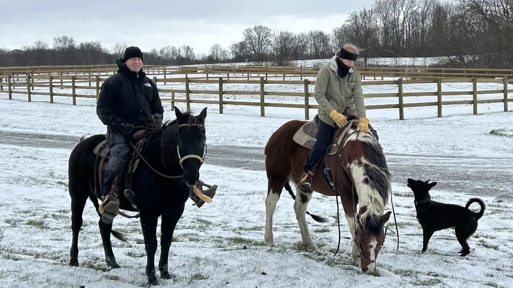 Patrick Kapenga and his daughter Christelle riding horses in the Michigan winter